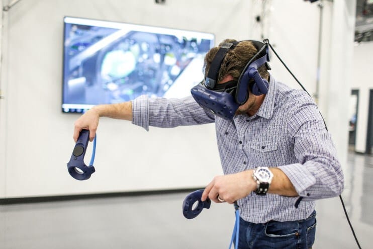 Ford Manufacturing Engineer using virtual reality to configure a production line
